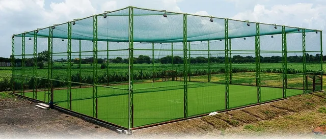 Outdoor box cricket arena with turf and netting built by Icon Infrastructure