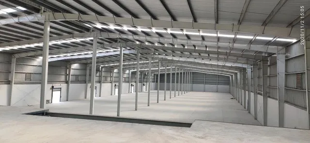 Interior of a clear-span steel warehouse with exposed roof structure